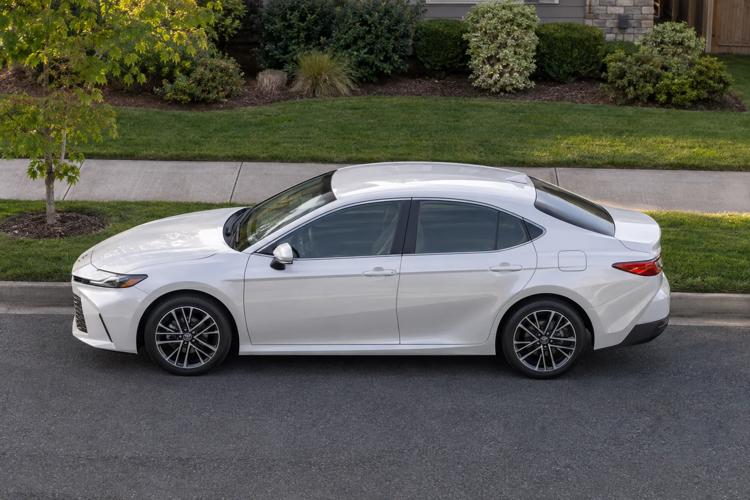 A white sedan with each window tinted the way Washington law allows